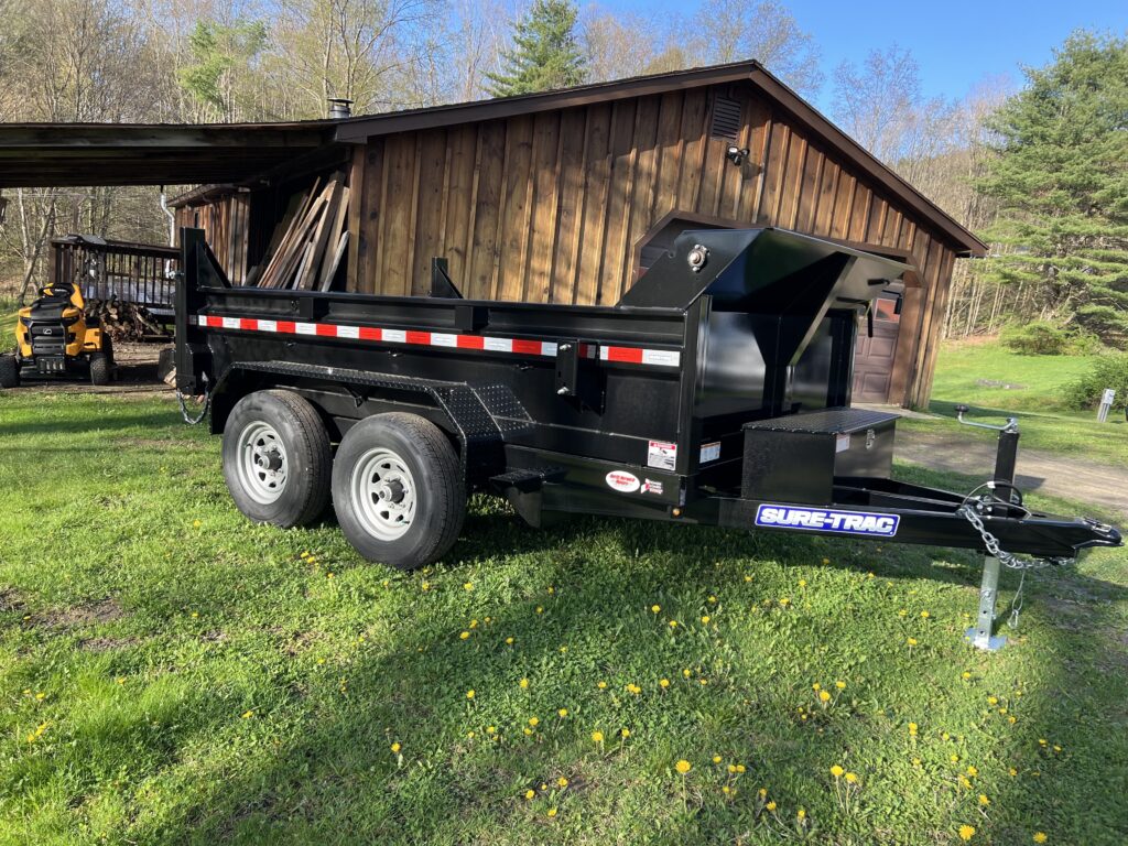 side view of dump trailer servicing oneonta ny trailer rentals serving west oneonta, colliersville, emmons, cooperstown junction, west davenport, davenport, portlandville, milford center, maryland, chaseville, schenevus